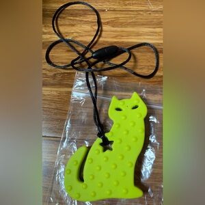 Chewable jewelry - big green cat on black cord